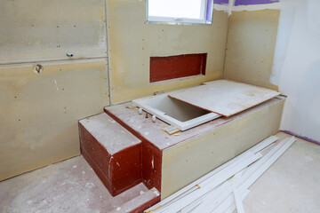Interior of bathroom with bathtub interior drywall ready for tile in new home