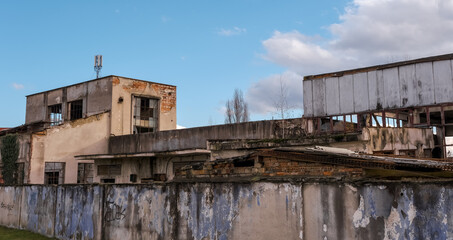 Fototapeta na wymiar abandoned factory warehouse with broken windows
