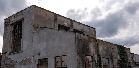 abandoned factory warehouse with broken windows