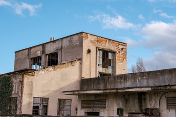 Fototapeta na wymiar abandoned factory warehouse with broken windows