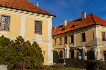 Fototapeta premium Baroque chateau with clock tower, Castle and town gallery with Christmas decorations in winter sunny day, medieval city Kladno, Central Bohemia, Czech Republic