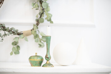 A wreath of eucalyptus in the interior. Japanese design combined with Scandinavian minimalism in a modern light house-Japandi. Soothing decor for peace of mind.
