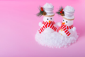  Happy Male and Female Snowmen on minimal Winter  light pink background