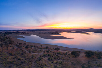 Fototapeta na wymiar Drone aerial panorama of a dam lake reservoir at sunset in Terena, Portugal
