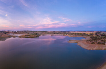 Fototapeta na wymiar Drone aerial panorama of a dam lake reservoir at sunset in Terena, Portugal