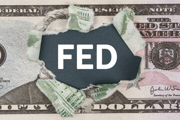 The dollar is torn in the center. In the center it is written - FED