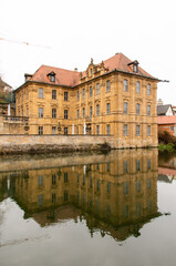 Fototapeta na wymiar Bamberg, Germany, 20.12.2020. The famous Villa Concordia is reflected in the water of the Regnitz. High quality photo