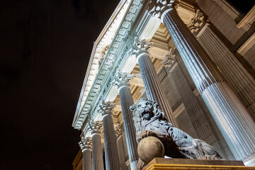 night view of the main facade of the Palacio de la Cortes, seat of the Congress of Deputies in...