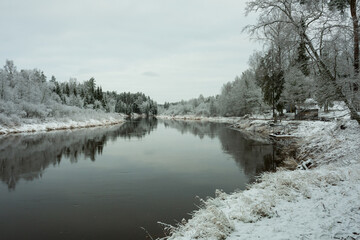 City Cesis, Latvia.River Gauja at winter,  trees and snow.