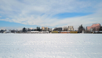 Fototapeta premium Afternoon panorama of the snowy suburbs