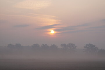 sunrise over the fog
