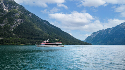 Fototapeta na wymiar lake achen surrounded by mountains in Tirol Austria