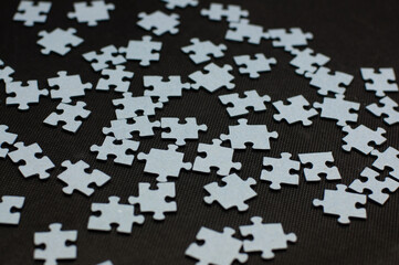 Puzzle pieces on the black background