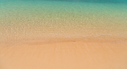 Fototapeta na wymiar wave beach sand clear background aqua turquoise