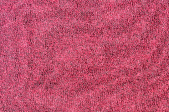 Texture of burgundy red warm woolen fabric