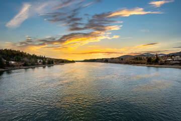 The Priest River seen at sunset from the Wisconsin Street bridge in the town of Priest River, Idaho...