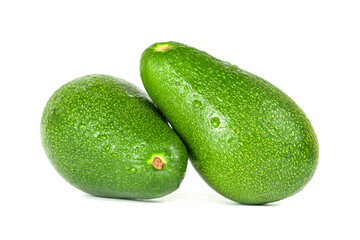 Two green avocado closeup on a white background.