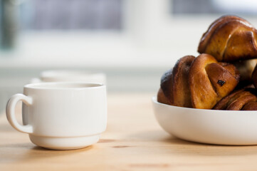 Cup of coffee and delicious croissants. On a wooden tray. Breakfast morning