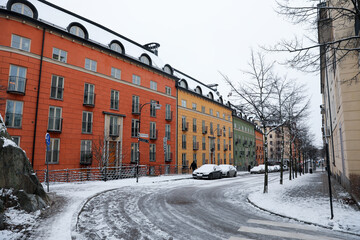 Fototapeta na wymiar Colorful apartment building street in winter