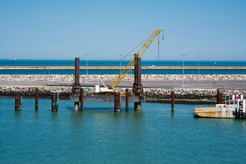 Fototapeta na wymiar Crane in port of Calais, France