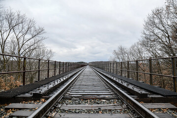 Empty railroad train tracks and bridge