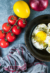 Tasty breakfast with fried egg on grey table