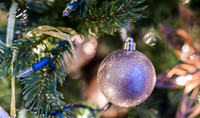 Christmas Holiday ornaments hanging from the tree