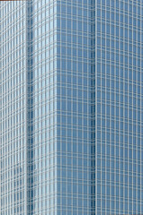 Fototapeta premium Structural modern glass windows in building walls Futuristic reflective façade found in modern buildings 