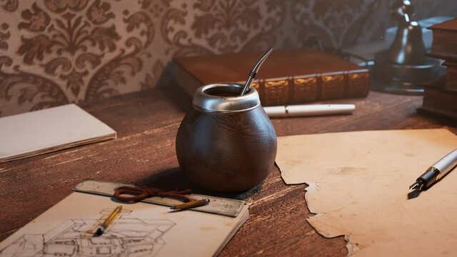 Traditional yerba mate on a vintage desk. Energy herbal drink. Gourd with straw