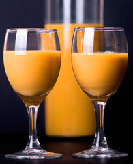 egg liqueur in a glass on wood