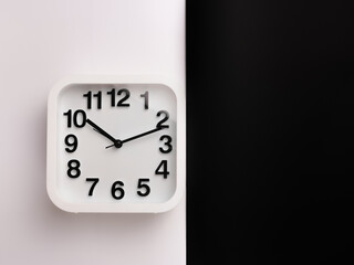 Top view image of square alarm clock isolated on white and black background. 