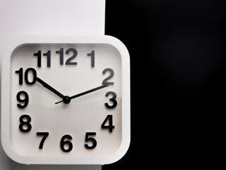 Top view image of square alarm clock isolated on white and black background. 