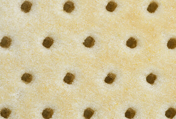 Detalle de la textura de la base de una pizza.