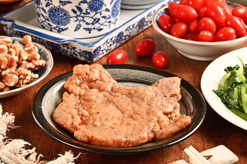 Delicious juicy pork chop on the plate     