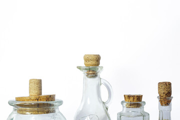 Isolated glass jars and bottles with cork lids