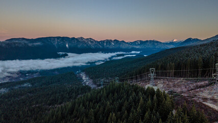 Snowline visible on mountain ranges over valley