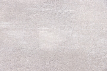 A light gray blank background that simulates the texture and surface of a stone.