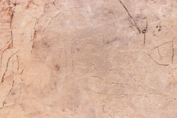 Light beige blank background with brown stains imitating the texture of marble.