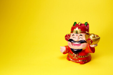 God of wealth holding gold ingot, Chinese text translation: gold and wealth