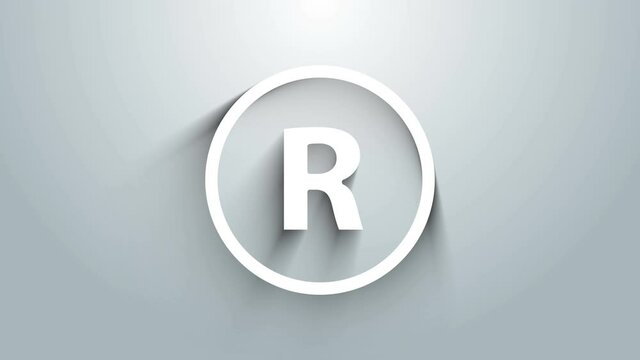 White Registered Trademark icon isolated on grey background. 4K Video motion graphic animation