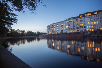 Fototapeta premium apartments in the sunset at the river in the near of berlin castle park