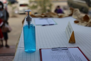 Plastic bottle insert Blue gel, alcohol, hand sanitizer for cleaning hygiene, anti-corona virus or antibacterial, placed on the table.