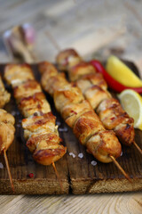 Juicy chicken skewers on wooden sticks.