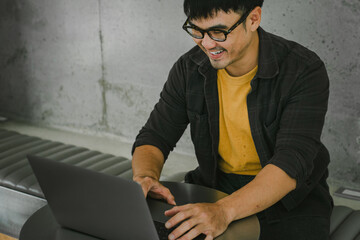 man work using computer hand typing laptop keyboard contact us online chatting search form internet sitting at office.concept for technology device communication business people