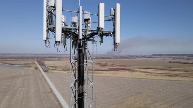 Cellphone tower showing electronics and a smoky horizon.