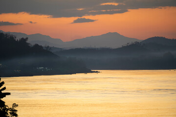 Mekong river view in evening with foggy twilight sunset sky at Chiang Khan, Loei, Thailand