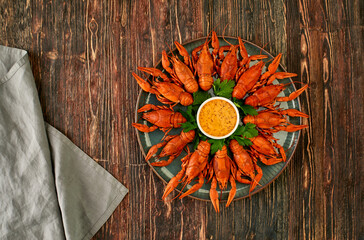 Crayfish-boiled river crayfish on a dark wooden background.Space for text.