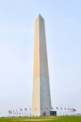 The Washington Monument obelisk encircled by American Flags in the national mall of Washington DC...