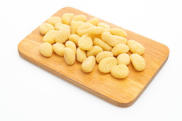 Traditional Italian gnocchi pasta uncooked on white background