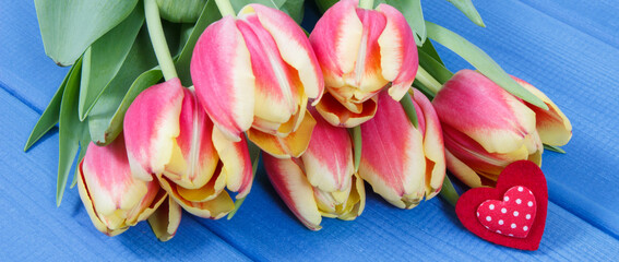 Bouquet of tulips on boards. Surprise for birthday, valentine or other occasion